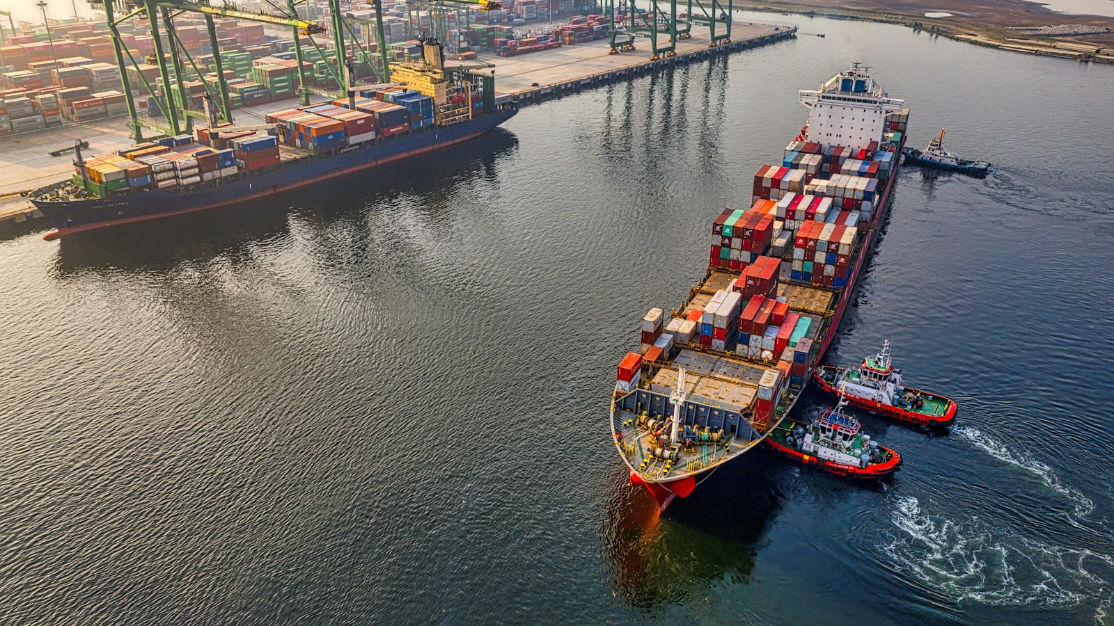 A container ship under way at sea, carrying export cargo.